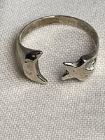 Open band ring showing star and moon terminals