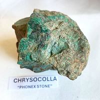 Front view of chrysocolla specimen with caption card