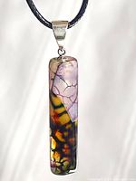 Close-up of pendant showing agate colours and silver bail