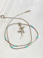 Necklace coiled to show bead pattern and pendant detail