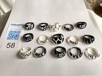 All fifteen acrylic rings arranged on sheet showing patterns