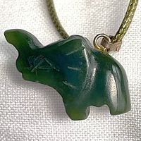 Close-up of carved nephrite jade elephant pendant