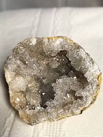 Open face of one quartz geode half showing crystal interior