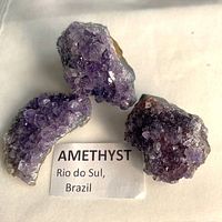 Three amethyst clusters with origin label