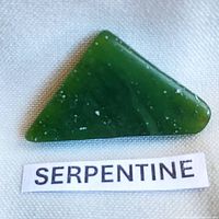 Front view of triangular green serpentine stone labeled 'SERPENTINE'