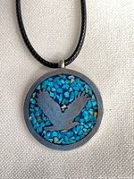 Front view showing turquoise inlay and bird silhouette