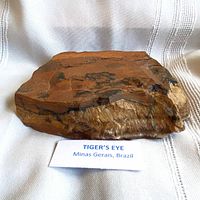 Oblique view of full tiger's eye specimen with origin label