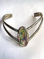 Front view of Alpaca Mexico cuff showing abalone inlay and double band