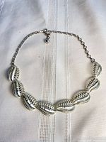 Full view of silver-tone shell motif choker necklace