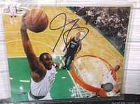 Front view of signed 8x10 photo showing full image and autograph