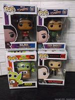 All four boxed Funko Pop figures stacked for overview