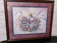 Front view of framed F. Buckley angel print with maroon and blue mats