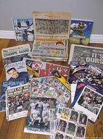 overview of lot with newspapers, magazines, cards, banner