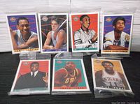 Seven sealed Kellogg’s basketball cards laid out