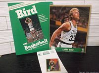 Book, photo, notepad and trading card grouped