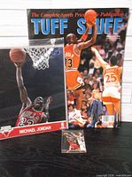 Group shot of magazine, photo, and trading card