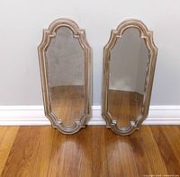 Front view of both mirrors showing shape and finish