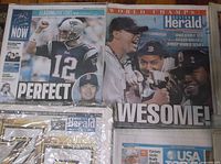 Overview showing Patriots "PERFECT" and Red Sox "AWESOME!" front pages