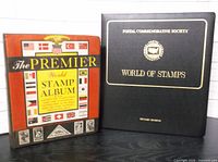 Front view of both albums standing upright