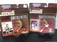 Front view of both sealed Timeless Legends boxing figures