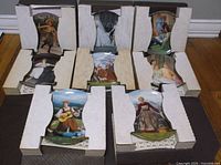Eight boxed Sound of Music plates displayed