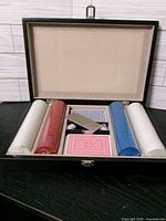 Open case showing chips, cards, accessories
