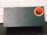 Closed green box with red B&A Bowls label