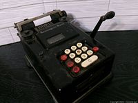 Front view showing keypad, Remington Rand badge, side lever