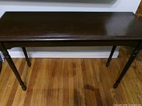 Front angled view of full table showing top and legs