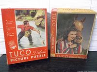 Front of both Tuco puzzle boxes showing artwork