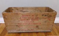 Overall view of wooden crate with red Danish ham stencil