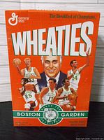 Front of sealed Wheaties box showing Boston Celtics graphics and Boston Garden tribute