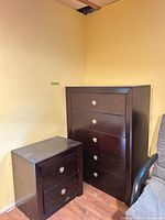 Dresser and nightstand side by side showing size and style
