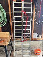 Pair of folded aluminum ramps strapped together