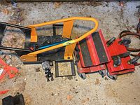 Overall view showing wheel chock stand, two red skates, action camera