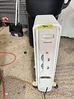 Front view of Honeywell oil-filled radiator showing control panel and casters
