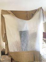 Beige fabric piece with white inner panel displayed