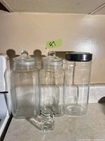 All four jars grouped to show sizes and lid types
