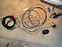 overview of all cables, antenna mount, power adapter, cable ties on carpet
