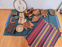 Overall lot layout showing bowls, placemats, coasters and decorative items