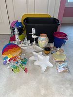 Overview of tote, dishes, decor, lights, buckets and vase