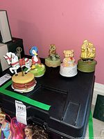 Group view of all five ceramic music boxes