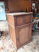 Front and side view of wood host stand showing drawer front and lower cabinet