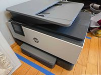 Overall view of HP OfficeJet Pro 9010e printer showing exterior condition and automatic document feeder