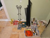 Overall view of entire lot against wall showing tools, brackets, screen rolls, extension cord tubs