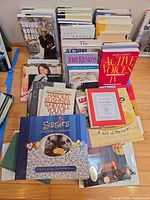 Group of stacked books showing variety and some front covers