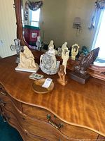 All seven religious pieces on dresser
