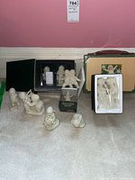 Overall lot showing boxed and loose Snowbabies figurines