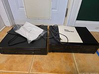Sony cassette deck and Yamaha CD changer side by side with manual and cords