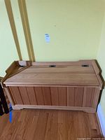 front view of solid wood storage bench with lid closed